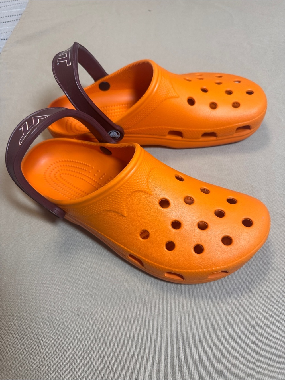 Men’s Orange Crocs Sandals with a Virginia Tech Maroon Strap